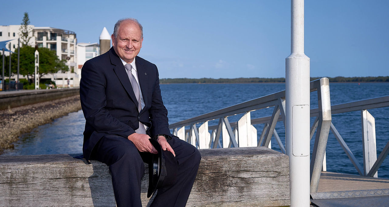 funeral director sitting on wharf by the water