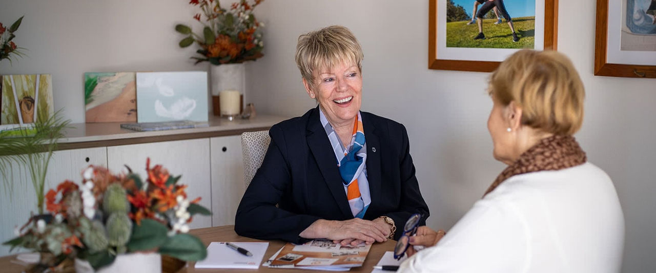 funeral director helping woman