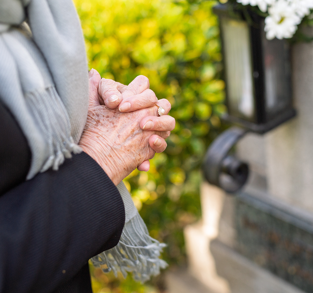 woman at graveside