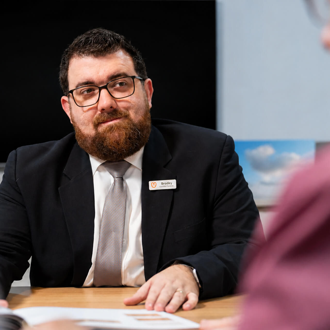 funeral director helping family