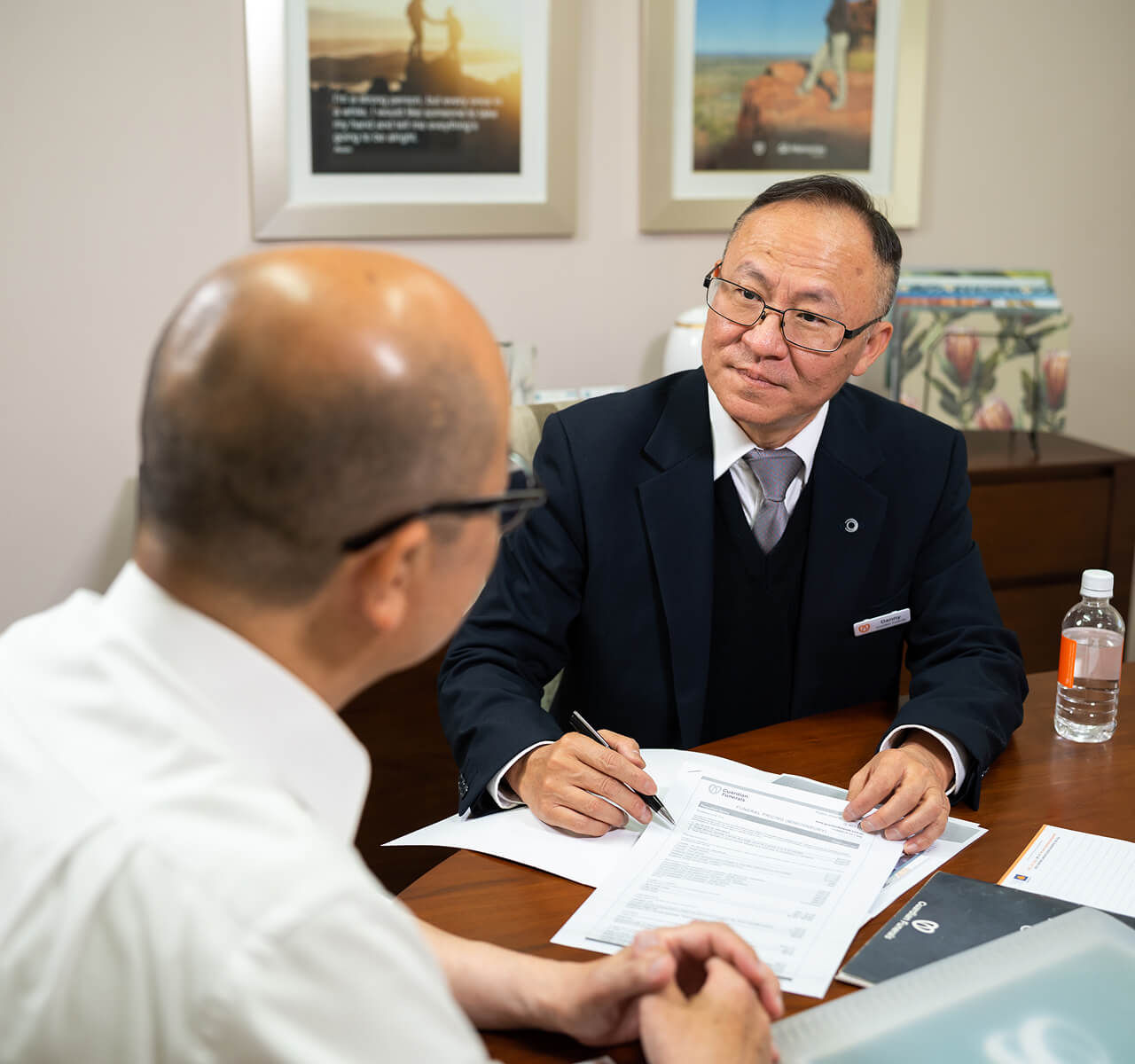 funeral director helping man