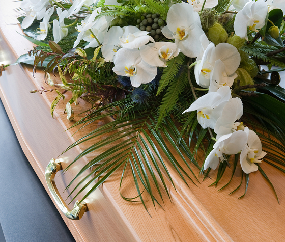 coffins with floral arrangement